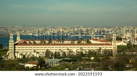 Istanbul, Turkey - January 22, 2021: View of Istanbul Selimiye Barracks, Bosphorus and Istanbul cityscape. Selimiye Barracks is a historical structure. Panoramic shot, blue sky background. 