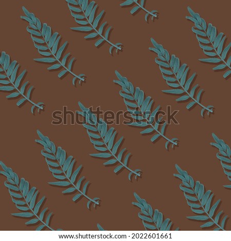 Green fern leaf with bright Brown background and sun shadow. Summer tropical concept.