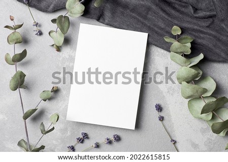 Greeting or invitation card mockup with textile, dry lavender flowers and eucalyptus twigs