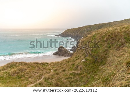 Wild beautiful seascape of Galicia, Spain during sunset. Lonely beach. Summer travel concept. Freedom, relax. Beauty of nature.