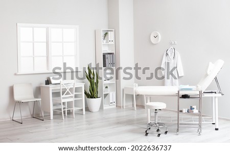 Interior of modern doctor's office in clinic Royalty-Free Stock Photo #2022636737