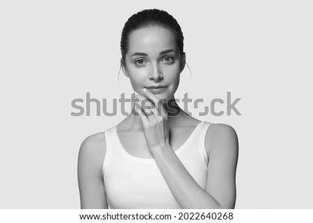 Beautiful monochrome woman beauty face cosmetic concept studio portrait close