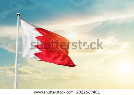 Bahrain national flag waving in beautiful clouds. Royalty-Free Stock Photo #2022669401