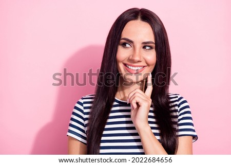 Portrait of pretty dreamy curious cheerful girl making decision copy space isolated over pink pastel color background