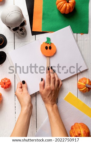 Making Halloween pumpkin bookmark craft