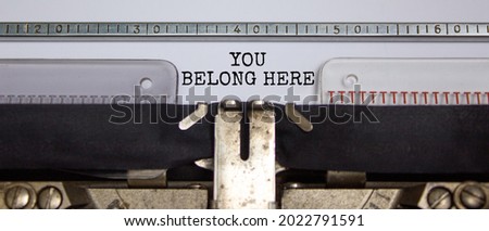 You belong here symbol. Words 'You belong here' typed on retro typewriter. Diversity, inclusion, belonging and you belong here concept. Copy space.