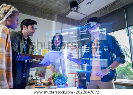 Creative digital development agency and Augmented Reality concept.businessman use VR Glasses(Virtual Reality Headset) for ux developer and ui designer about mobile app interface at modern office. Royalty-Free Stock Photo #2022847892