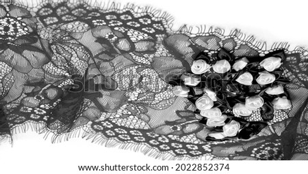 Black lace with floral pattern. DIY crafts. Designer accessories. Decorations for your projects. Elastic finish. Texture background pattern