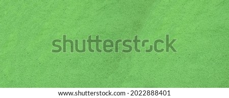 Green rough painted concrete wall texture background
