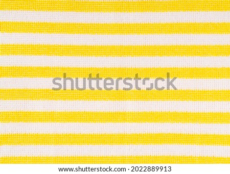 Yellow striped fabric perfect for background.