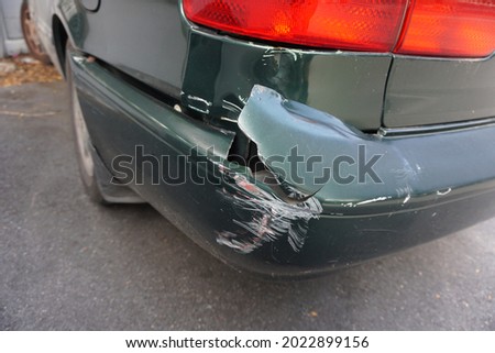 My car was hit and the rear bumper broke.