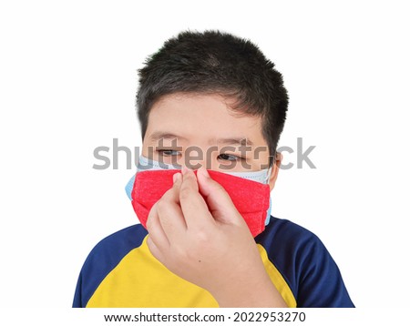 Boy wearing a double layer mask to prevent covid 19 virus on isolated white background. The concept of wearing a double mask self defense 