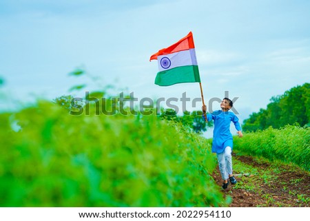 Indian child celebrating Independence or Republic day of India Royalty-Free Stock Photo #2022954110