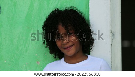 Happy Brazilian little girl portrait. close-up hispanic African descent child