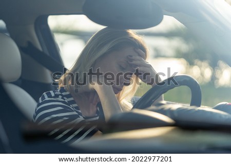 Depressed middle woman driver sitting inside car feeling doubtful confused about difficult decision suffering from personal psychological problem, burnout, quarrel break up with boyfriend, life crisis Royalty-Free Stock Photo #2022977201