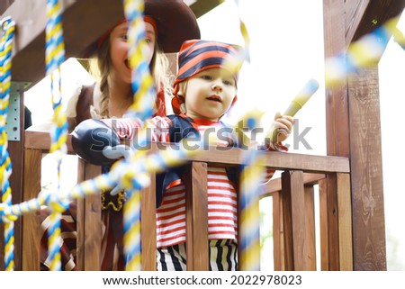 Children's party in pirate style. Children in pirate costumes are playing on Halloween.