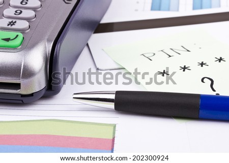 Business still-life of tables, payment terminal, credit Cards, pen, sticker