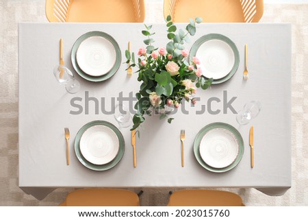 Table served in modern stylish dining room, top view Royalty-Free Stock Photo #2023015760