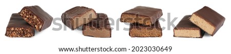 Set with different delicious protein bars on white background. Banner design Royalty-Free Stock Photo #2023030649
