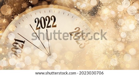 Clock counting last moments to New 2022 Year and beautiful fireworks on background, banner design Royalty-Free Stock Photo #2023030706