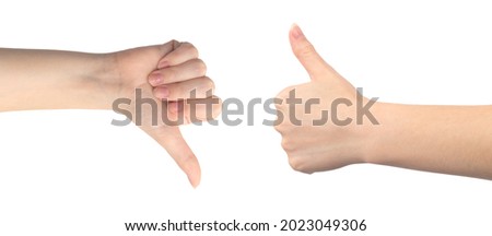 Like and dislike hand gesture, young female hand close-up, isolated on a white background photo