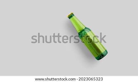 Top up view green beer bottle with blank yellow template isolated on grey background. beer fiesta concept. Royalty-Free Stock Photo #2023065323