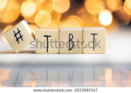 Hashtag TBT throwback Thursday written with wooden cubes with shiny bokeh background, social media concept colorful Royalty-Free Stock Photo #2023085567