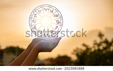 Zodiac signs inside of horoscope circle astrology and horoscopes concept Royalty-Free Stock Photo #2023085888