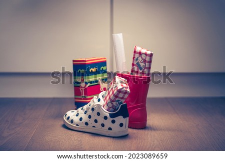 Sinterklaasfeest, children put down the shoe, early in the morning, typical Dutch party tradition, get presents, sweets and a letter in your shoe, (put the shoe down) December 5, Santa claus,  Royalty-Free Stock Photo #2023089659