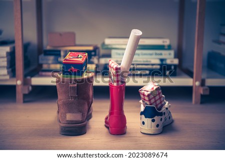 Sinterklaas feest, children put down the shoe, early in the morning, typical Dutch party tradition, get presents, sweets and a letter in your shoe, (put the shoe down) December 5, Santa claus,  Royalty-Free Stock Photo #2023089674