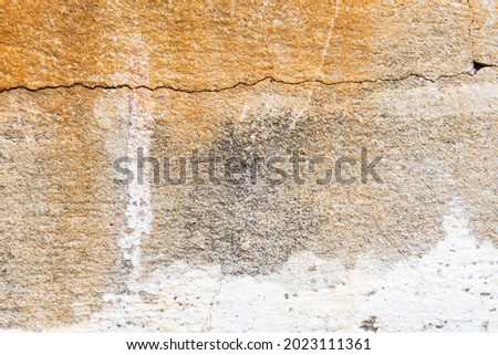 Close up of Old cement wall painted white, peeling paint texture and background.