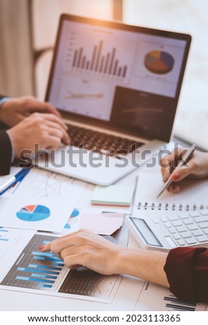 Team of business people are meeting to analyze data for marketing plan,Market research reports and income statistics, Financial and Accounting concept. Royalty-Free Stock Photo #2023113365