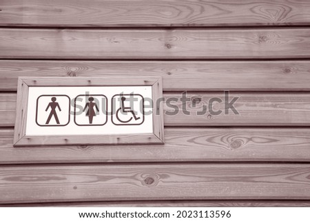 Male and Female WC Sign in Black and White Sepia Tone