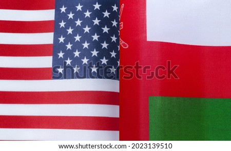 fragments of the national flags of the United States and Oman in close-up