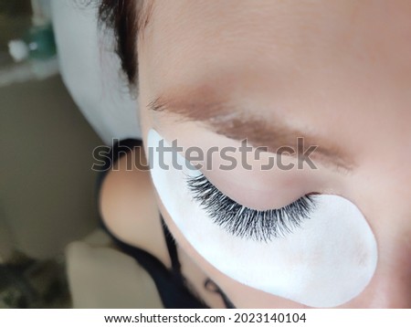 lash extensions in beauty salon macro eye top view 