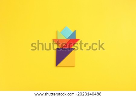 Wooden blocks flower isolated in yellow background