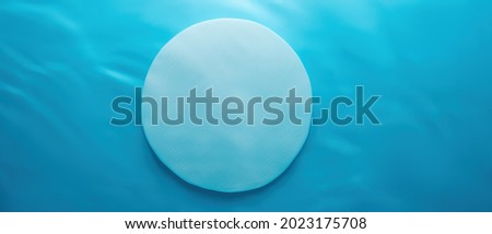 Empty white circle podium on blue water texture with waves in sunlight. layout, copyspace
Abstract background for product presentation.