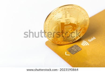Golden bitcoin on credit cards. Business, money, cryptocurrency concept.