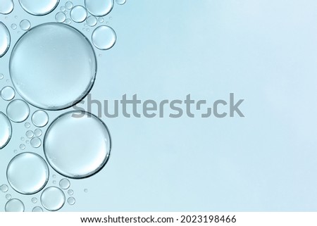 serum or cosmetic liquid water bubbles floats drops surface background