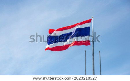 Thailand flag on sky windy day for asia national sign concept