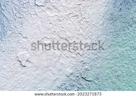 A fragment of colorful graffiti painted on a wall. Abstract urban background for design.