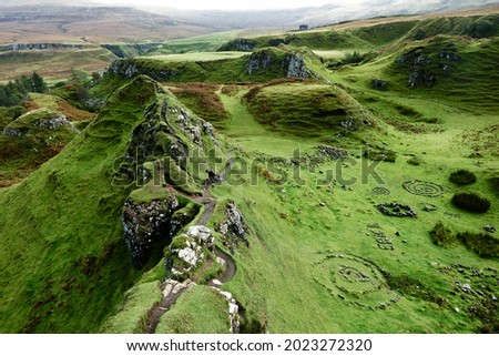 Fairy Glen, Uig, Isle of Skye, Scotland. Green meadow in the early morning. Royalty-Free Stock Photo #2023272320