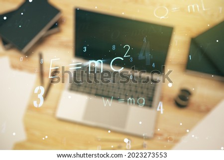 Double exposure of creative scientific formula concept on laptop background, research and development concept