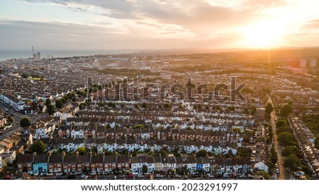 Aerial view of sunset by the Brighton. Royalty-Free Stock Photo #2023291997