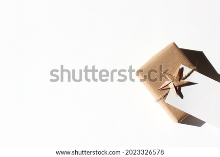 Stylish Gift Box Decorated with Greeting Card and Origami Star. Christmas Mockup.