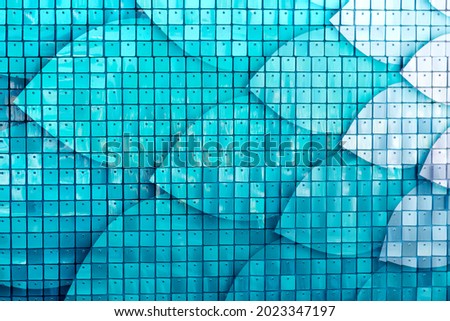 Creative blue background made of square small plates.