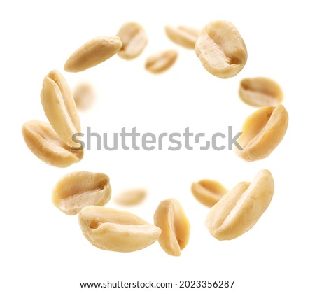 Peeled peanuts levitate on a white background Royalty-Free Stock Photo #2023356287