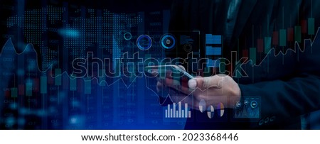 Double exposure of digital stock market concept. Businessman using smartphone with technology financial chart and planet hologram.