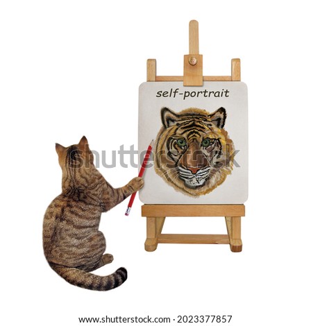 A beige cat artist with a pencil paints his self-portrait on a canvas on an easel. White background. Isolated.