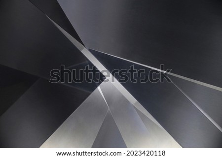 Angular metal panels. Steel sheets resembling abstract modern architecture exterior or interior detail. Industrial background in hi-tech style. Geometric pattern with polygons and triangles.